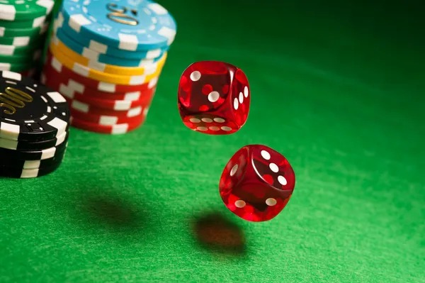 Live roulette wheel and dealer in studio setting